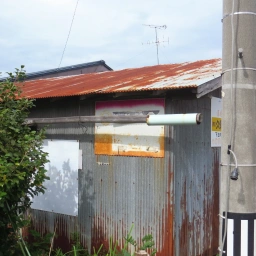 マルフク看板「電話の金融・販売 本八戸」